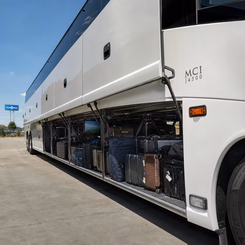 Party bus interior with wraparound leather seating and LED lighting in Grand Prairie
