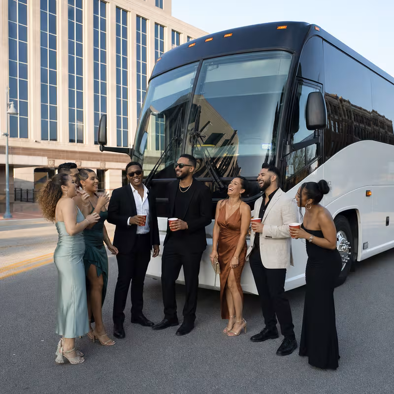 Passengers loading luggage while boarding an Grand Prairie group shuttle