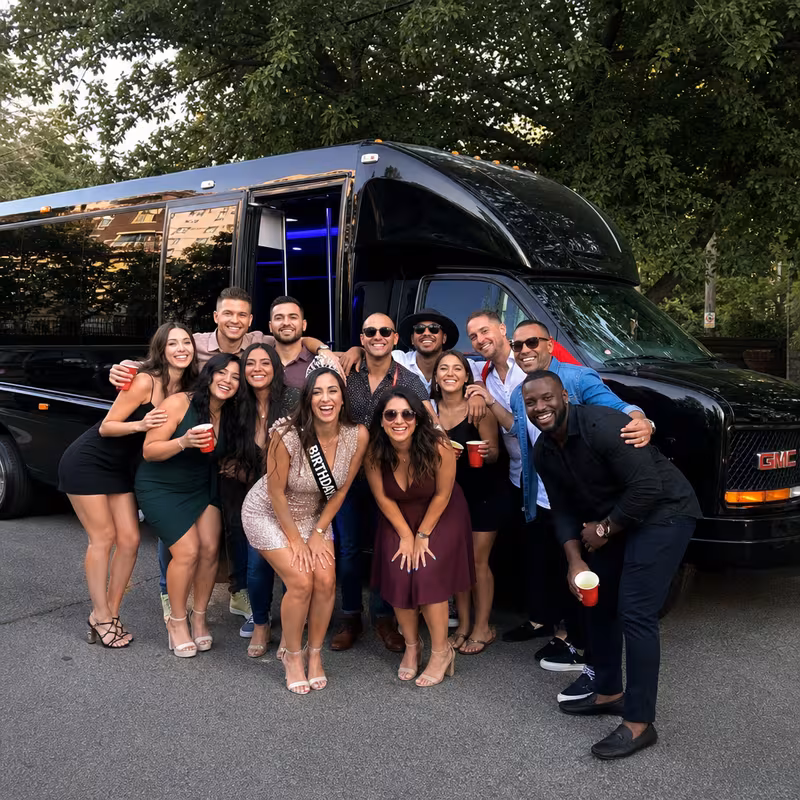 Group boarding a white charter bus for Birthday Transportation transportation in Grand Prairie