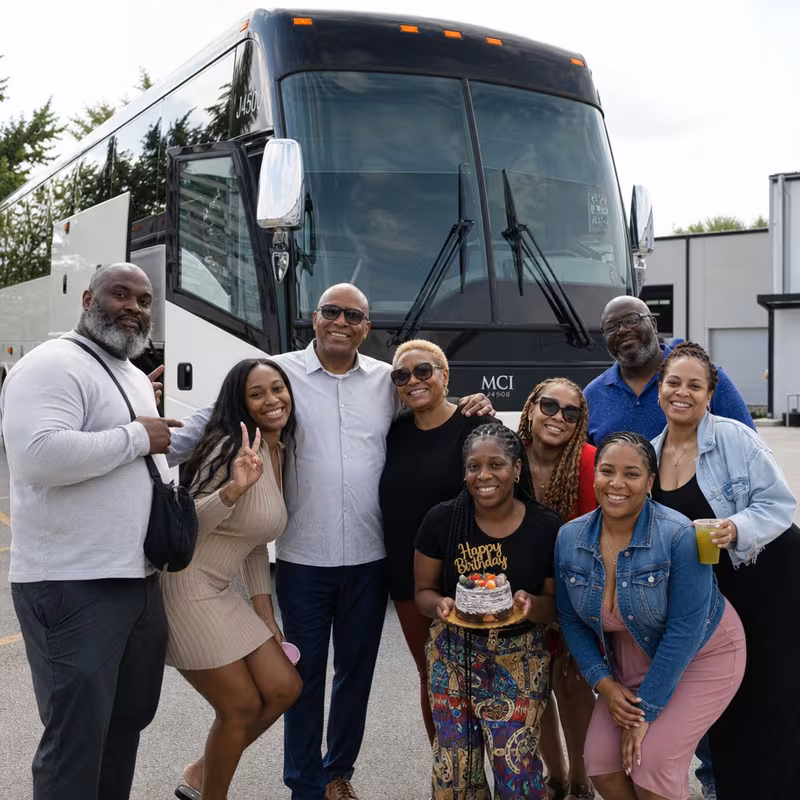 Passengers loading luggage while boarding an Grand Prairie group shuttle