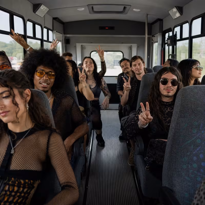 Party bus interior with wraparound leather seating and LED lighting in Grand Prairie