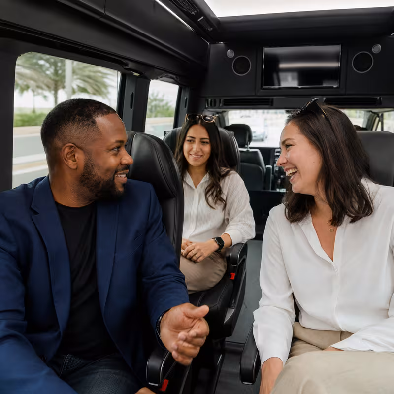 Group boarding a white charter bus for Corporate Transportation transportation in Grand Prairie