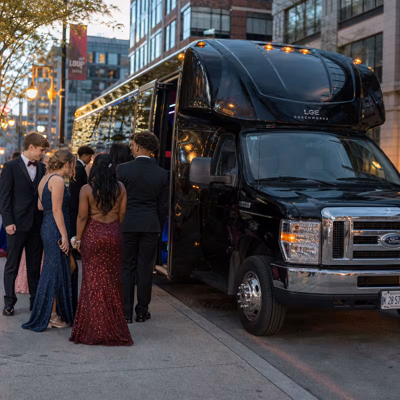 Passengers loading luggage while boarding an Grand Prairie group shuttle