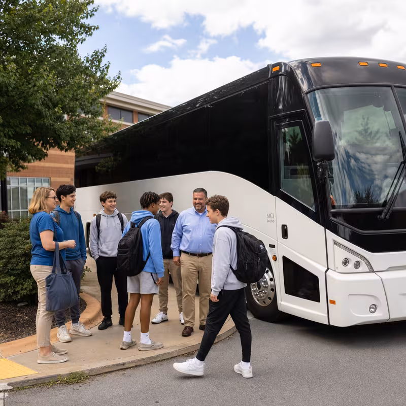 Passengers loading luggage while boarding an Grand Prairie group shuttle