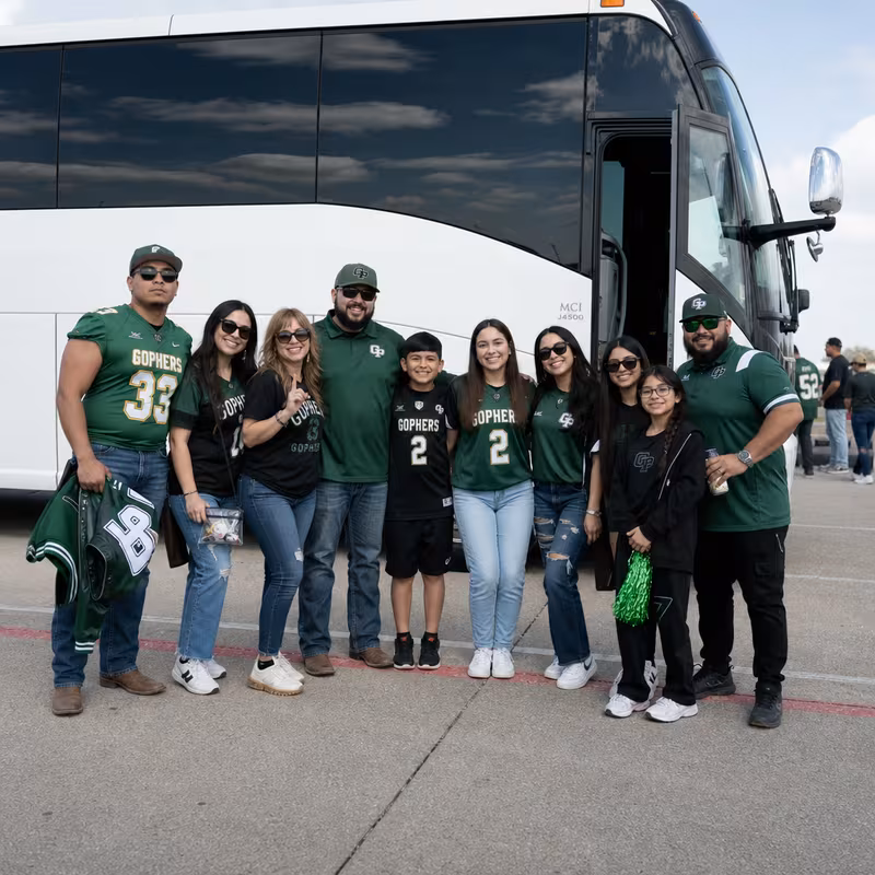 Passengers loading luggage while boarding an Grand Prairie group shuttle