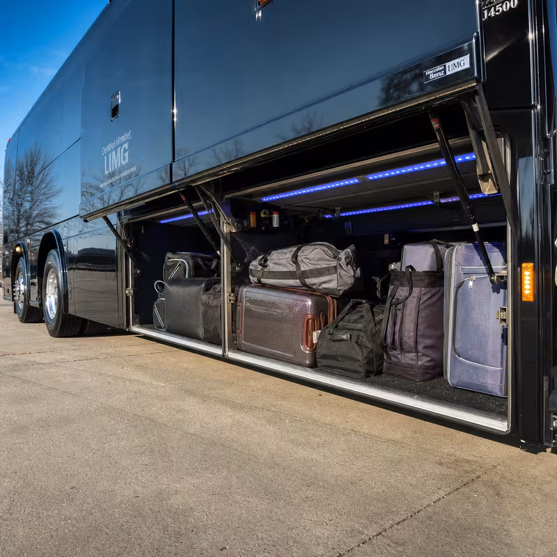 Party bus interior with wraparound leather seating and LED lighting in Grand Prairie