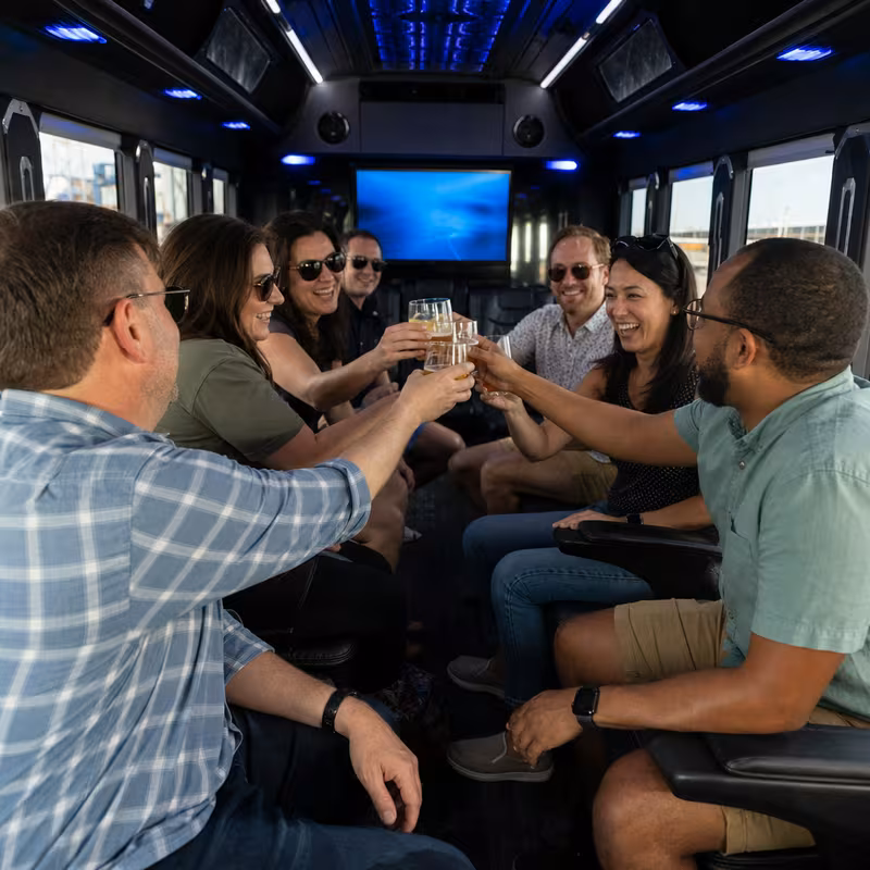 Group boarding a white charter bus for Winery & Brewery Tour Transportation transportation in Grand Prairie