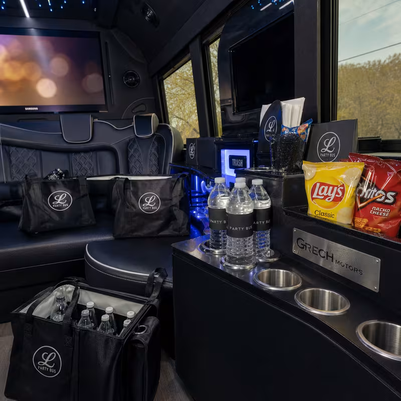 Party bus interior with wraparound leather seating and LED lighting in Grand Prairie